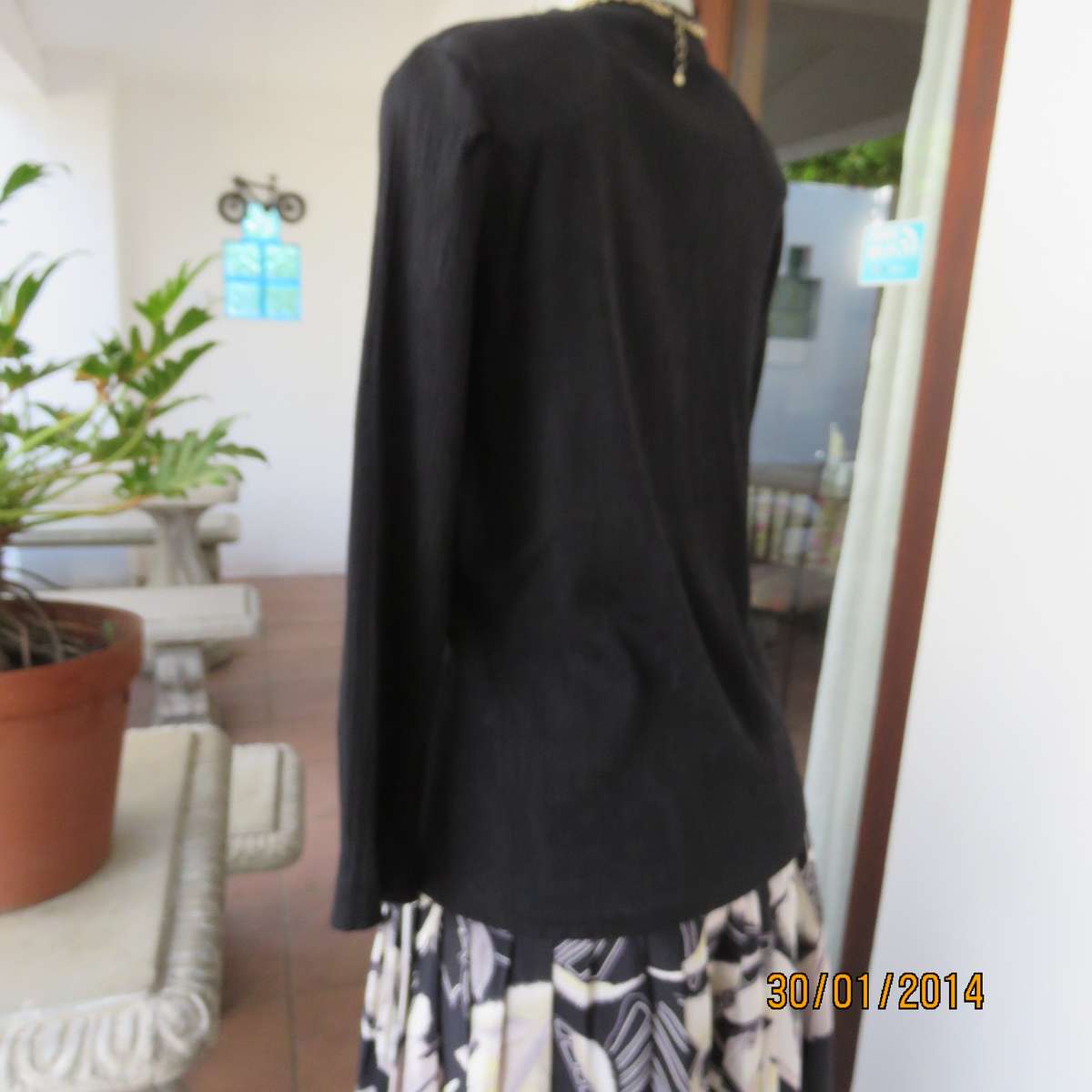 Black V neck button down long sleeve top in crinkled floral embossed polycotton. Size 34.