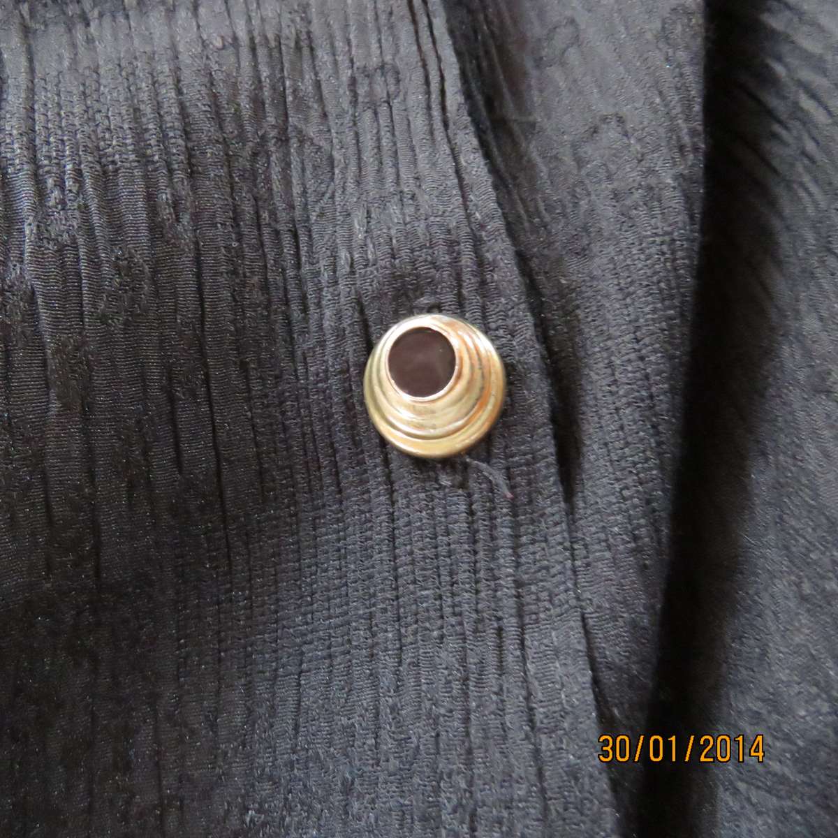 Black V neck button down long sleeve top in crinkled floral embossed polycotton. Size 34.