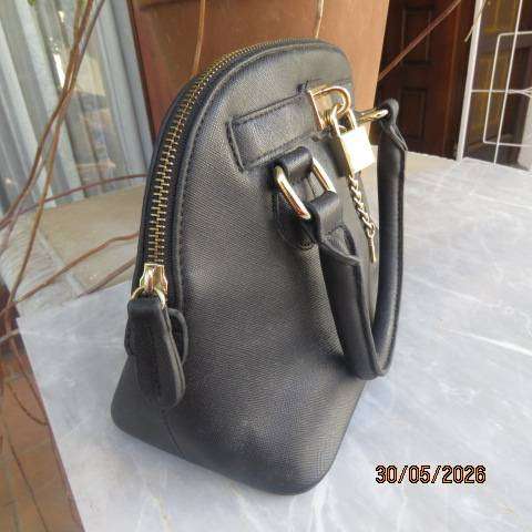 ALDO black hand-sling bag with zip-up closure and gilded lock and key. Never used