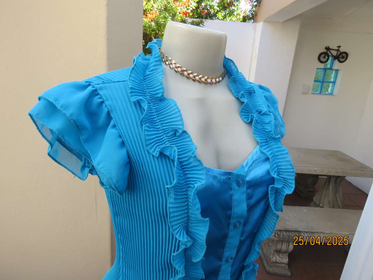 FORME teal blue permanent pleated top. Satin front inlay with frills. Size 36-38