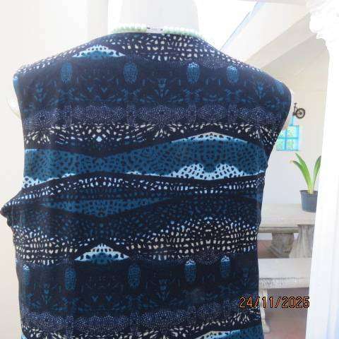 ROCKMANS sheer polyester sleeveless lined top in black with jade-light blue-cream print. Size 38