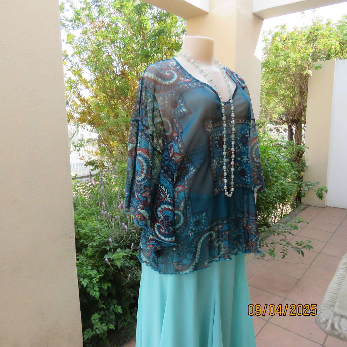 NEWS halfmoon sheer jade colour top with aqua-rust geometric print. Size 38