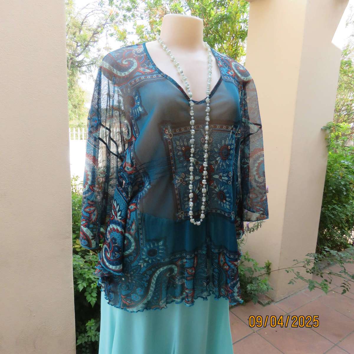 NEWS halfmoon sheer jade colour top with aqua-rust geometric print. Size 38