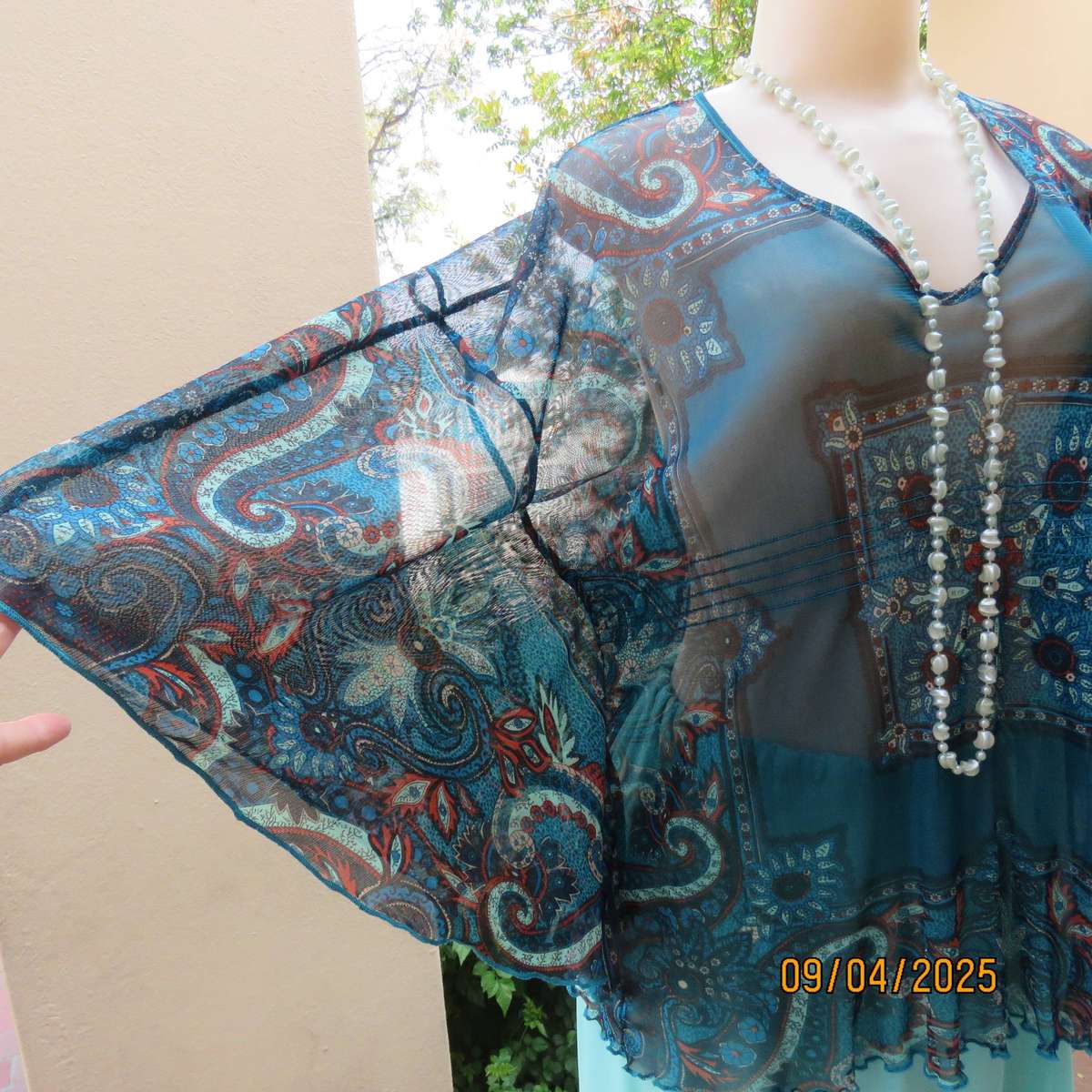 NEWS halfmoon sheer jade colour top with aqua-rust geometric print. Size 38