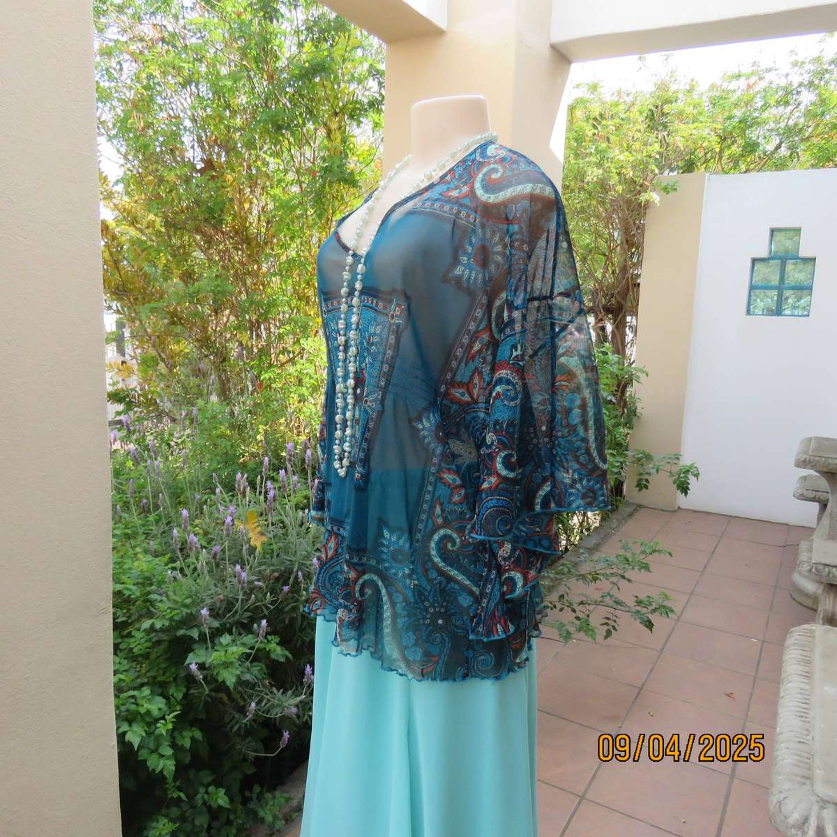 NEWS halfmoon sheer jade colour top with aqua-rust geometric print. Size 38
