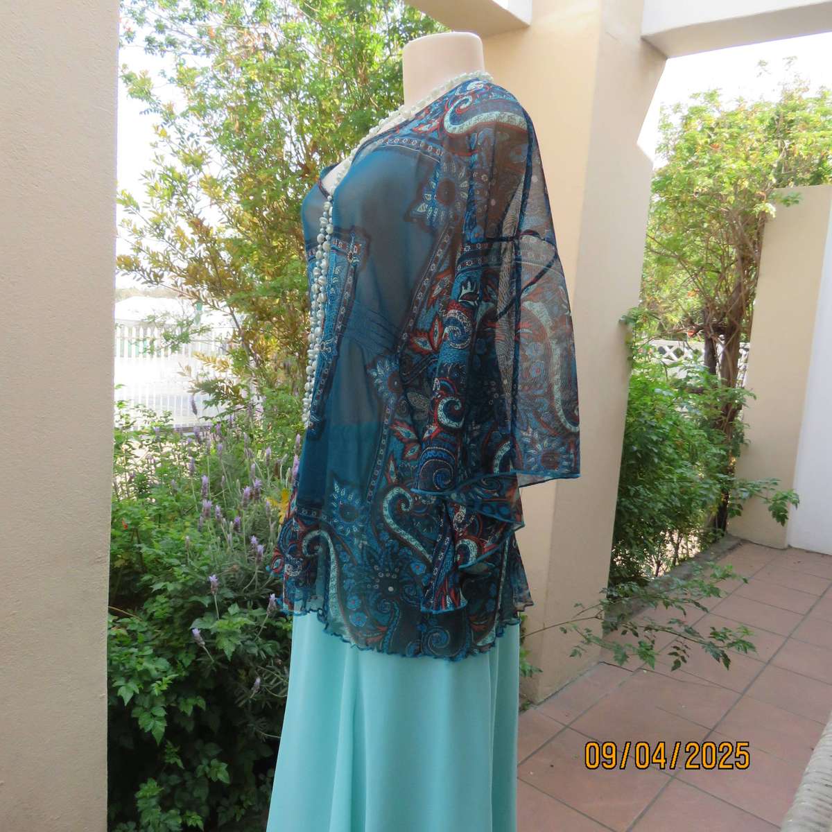 NEWS halfmoon sheer jade colour top with aqua-rust geometric print. Size 38