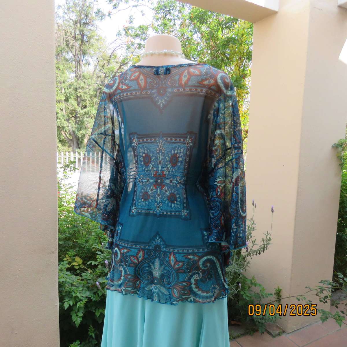 NEWS halfmoon sheer jade colour top with aqua-rust geometric print. Size 38