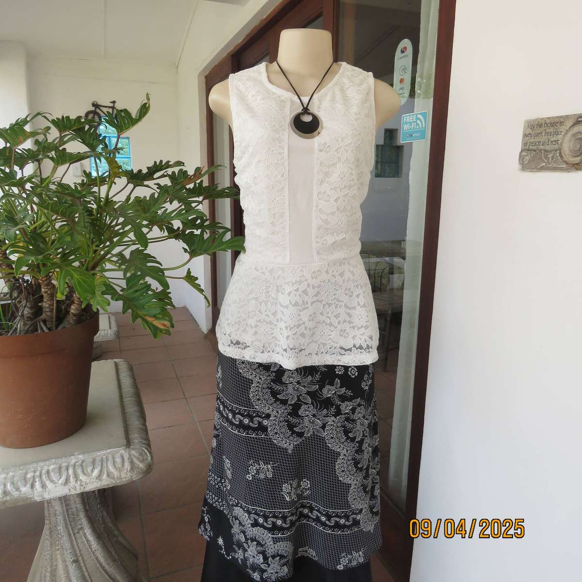 White stretch polyester lace slip over peplum top fully lined. Size 38