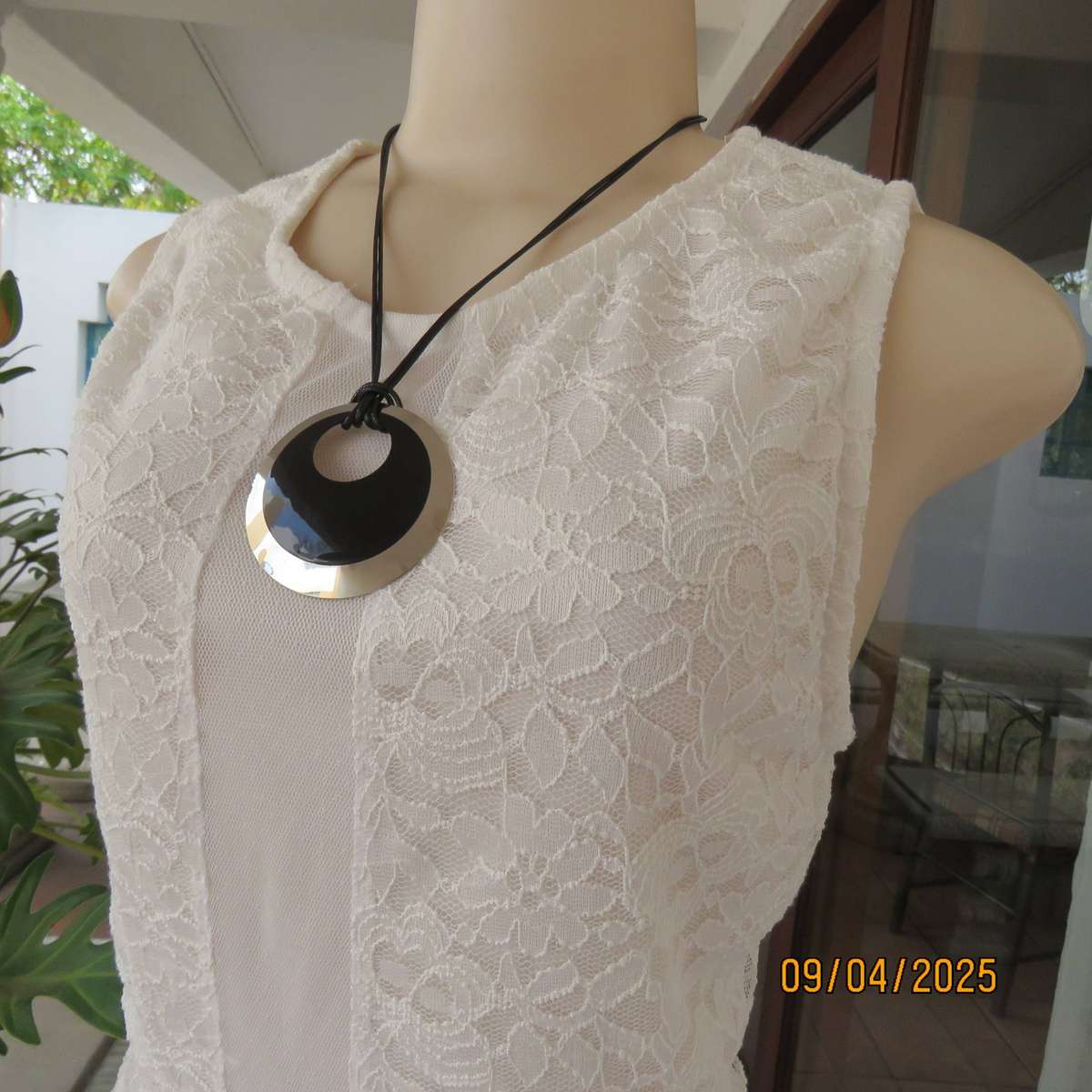 White stretch polyester lace slip over peplum top fully lined. Size 38