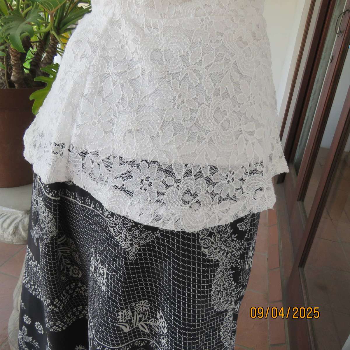 White stretch polyester lace slip over peplum top fully lined. Size 38