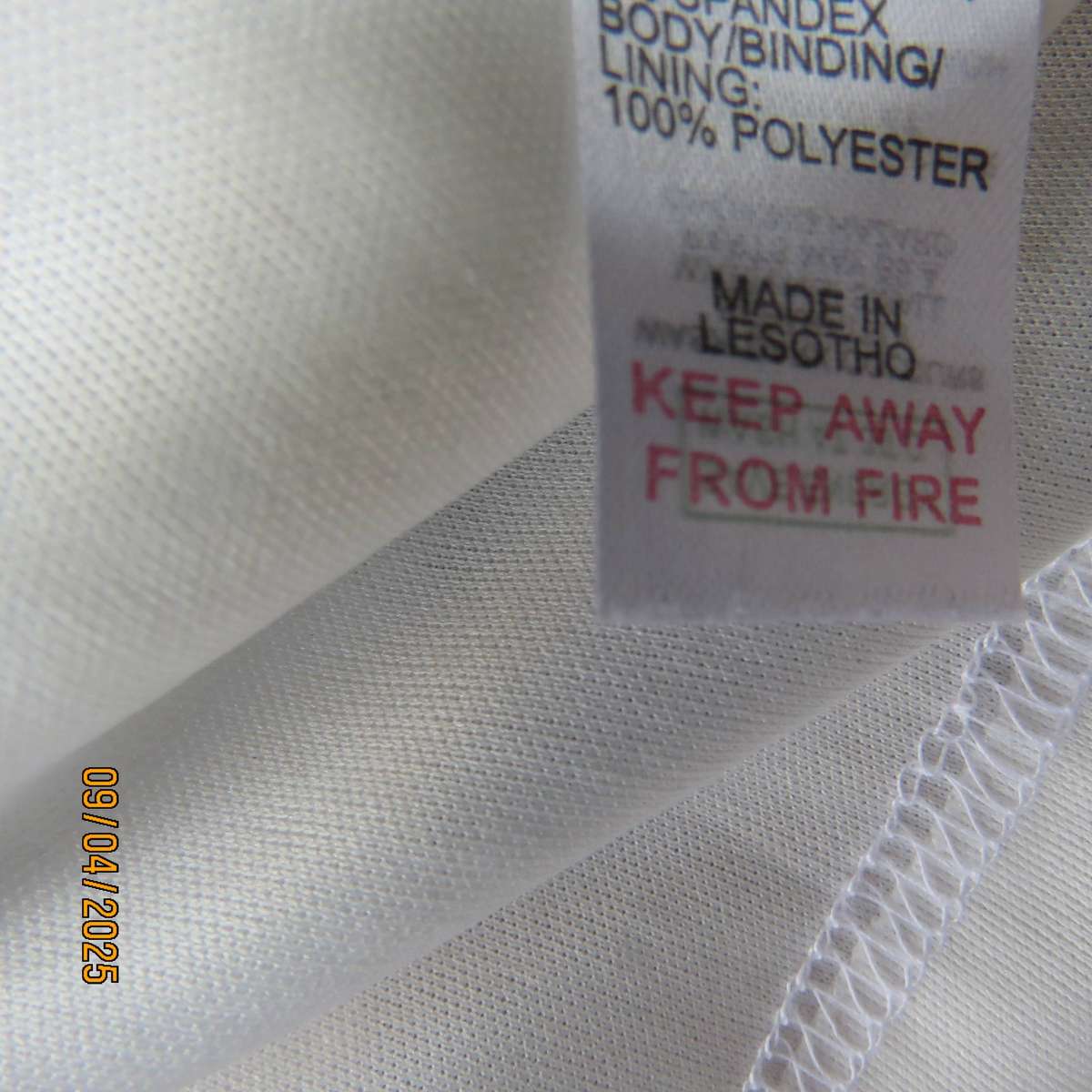 White stretch polyester lace slip over peplum top fully lined. Size 38