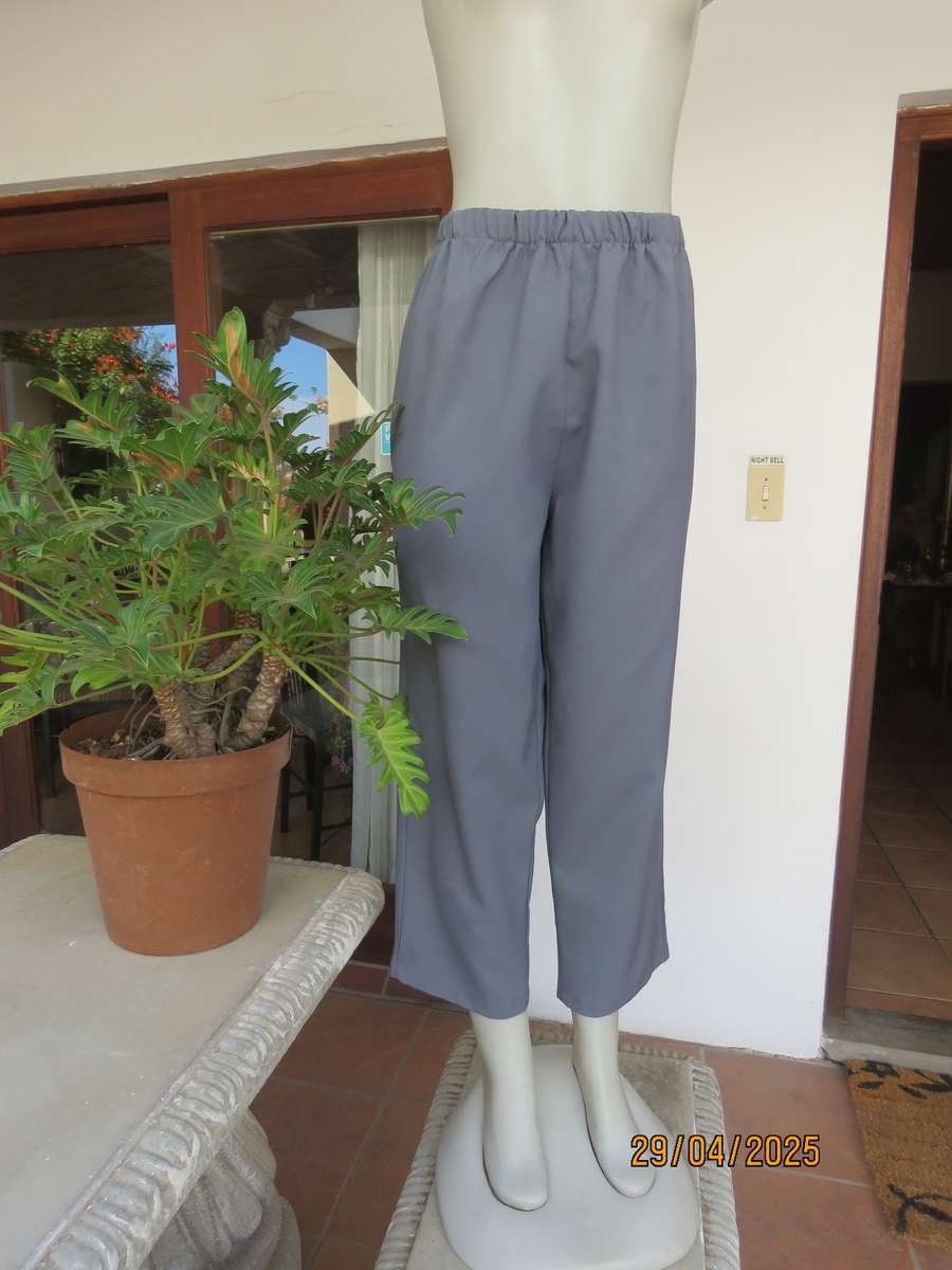 Boutique made hailstorm grey 100% polyester with elasticated waist. Size 40
