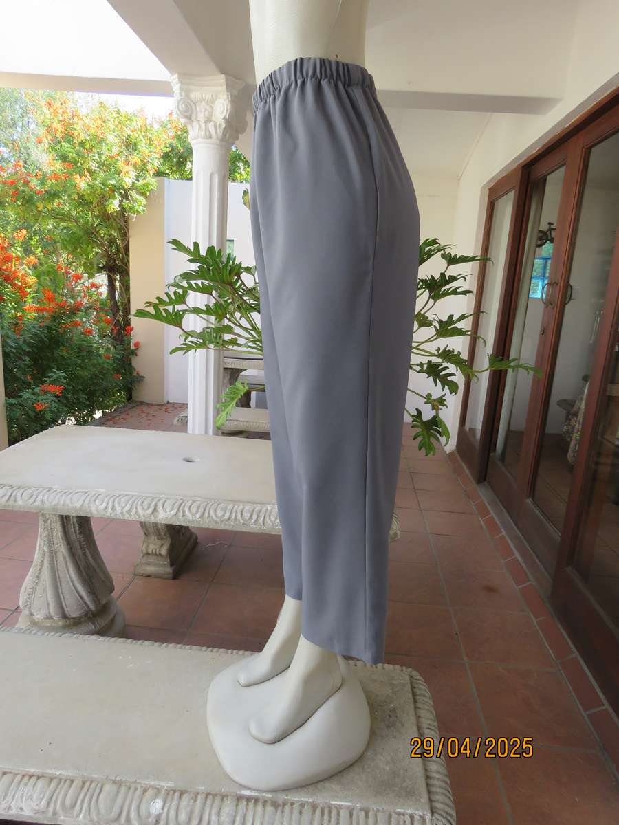 Boutique made hailstorm grey 100% polyester with elasticated waist. Size 40