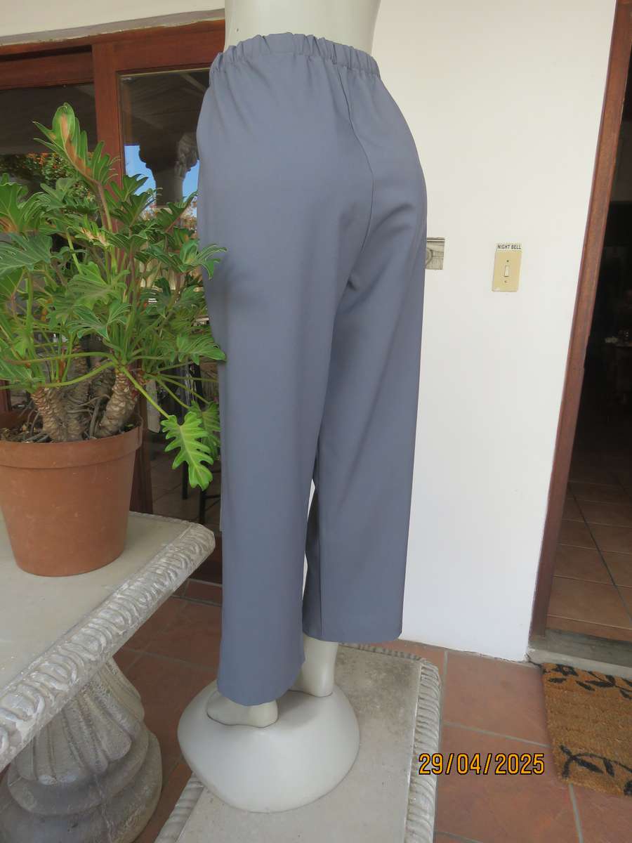 Boutique made hailstorm grey 100% polyester with elasticated waist. Size 40