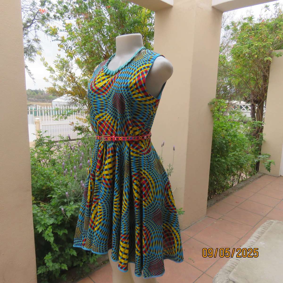 Colourful geometric printed flare sleeveless dress. Zip at back. Size 34