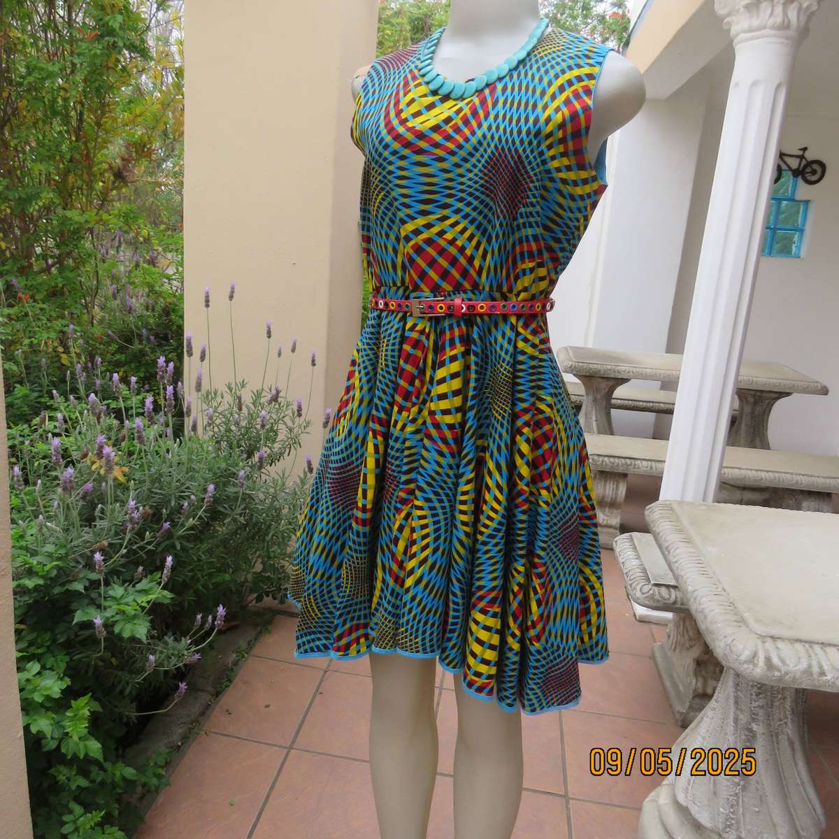 Colourful geometric printed flare sleeveless dress. Zip at back. Size 34