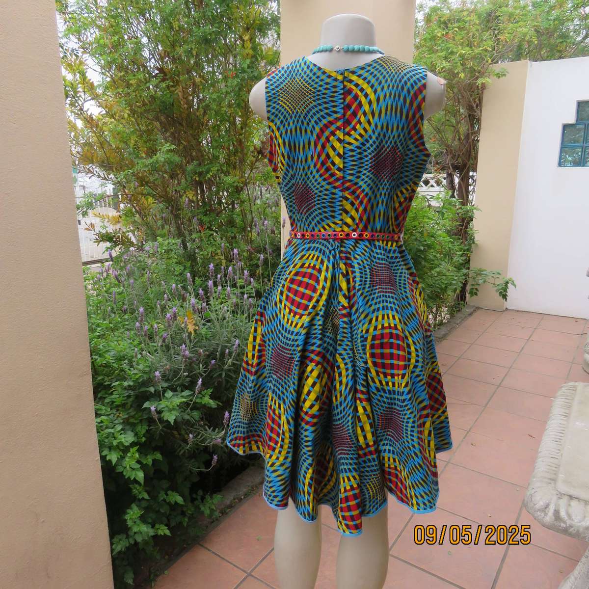 Colourful geometric printed flare sleeveless dress. Zip at back. Size 34
