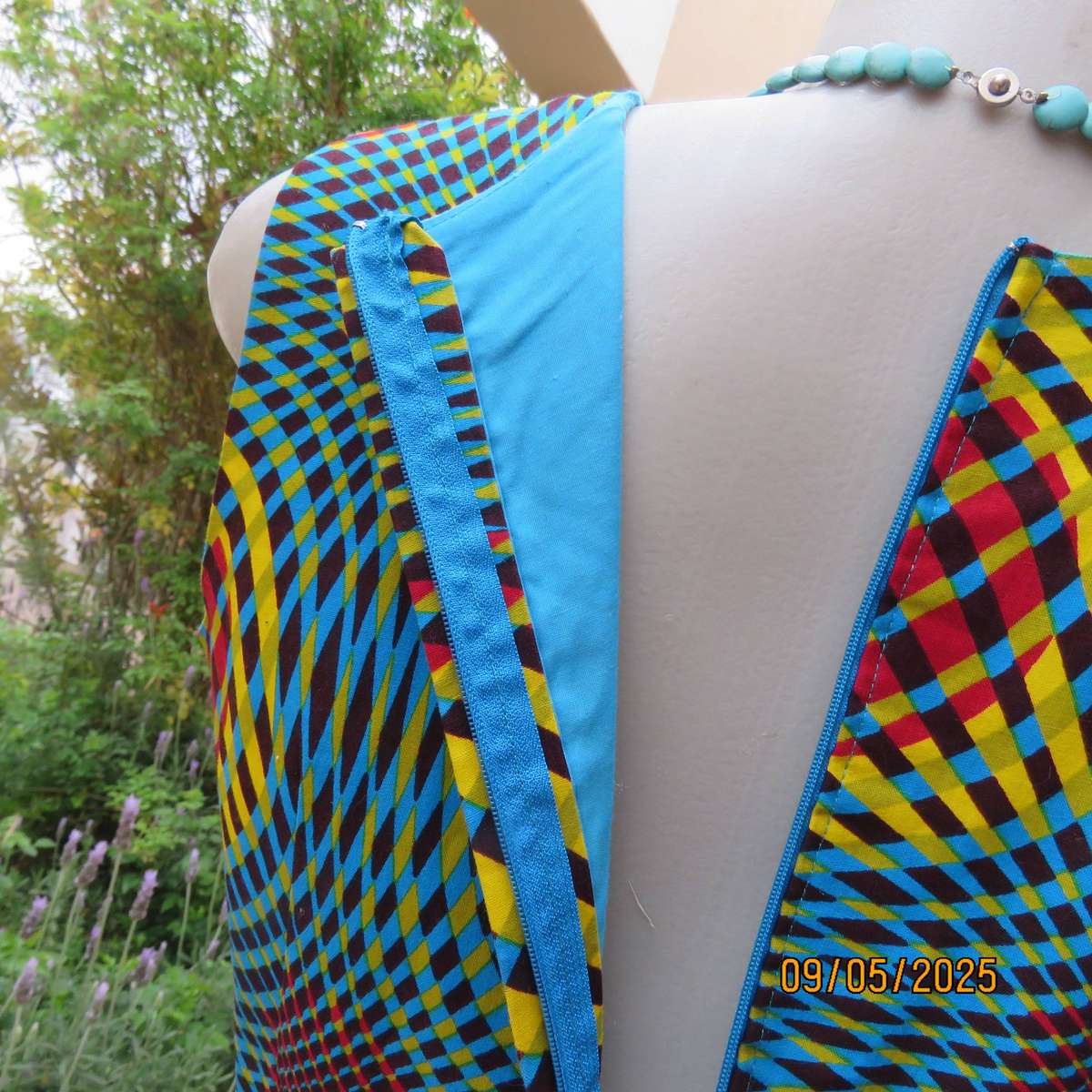 Colourful geometric printed flare sleeveless dress. Zip at back. Size 34