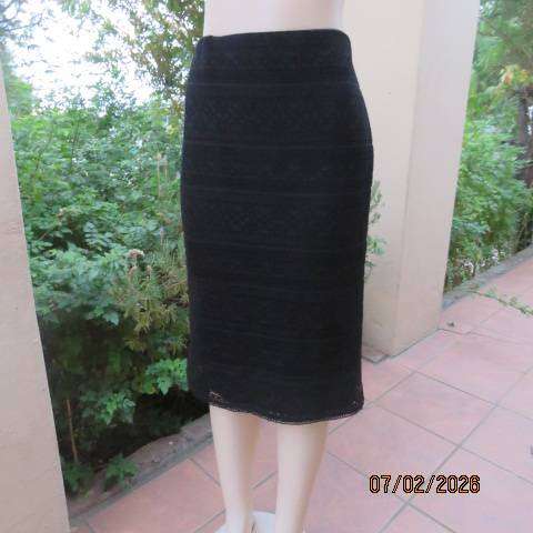 Very black stretch polyester pencil skirt with 2 layers - top layer in stretch lace. Size 40