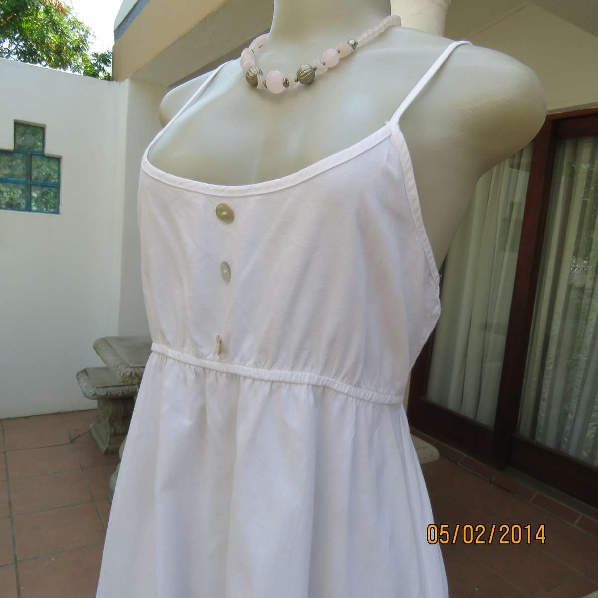 As new white slightly creased 100% cotton strappy dress. Size 36.Elasticated waist.Half flare skirt.