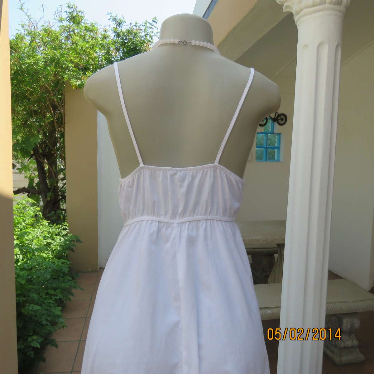 As new white slightly creased 100% cotton strappy dress. Size 36.Elasticated waist.Half flare skirt.