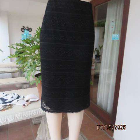 Very black stretch polyester pencil skirt with 2 layers - top layer in stretch lace. Size 40