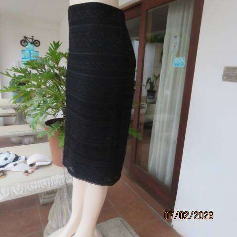 Very black stretch polyester pencil skirt with 2 layers - top layer in stretch lace. Size 40