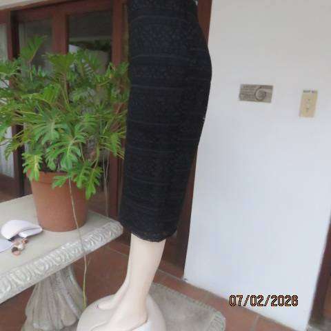 Very black stretch polyester pencil skirt with 2 layers - top layer in stretch lace. Size 40