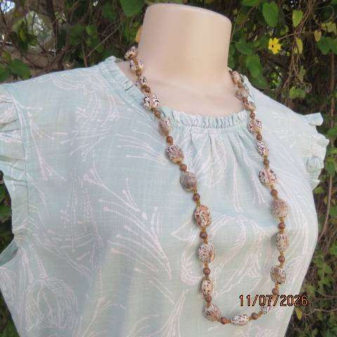 Bohemian handmade necklace with castor beans and brown beads, 78cm length