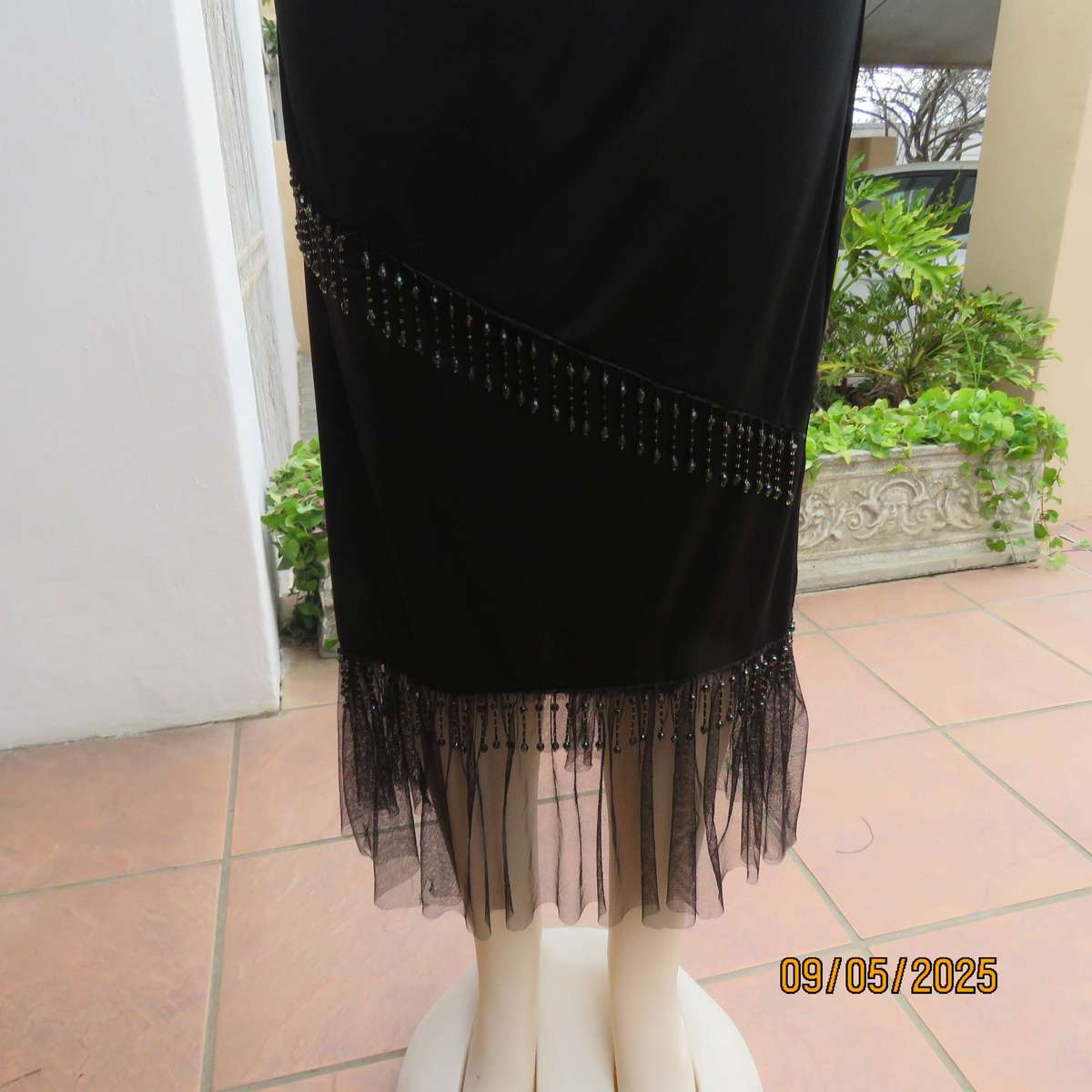Black stretch polyester ankle length skirt with elastic waist. Netting and beads. Size 36