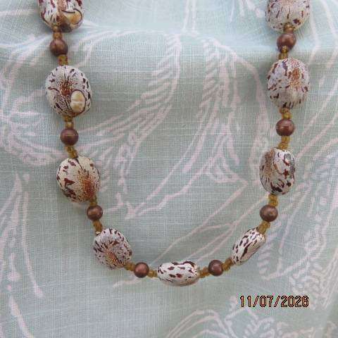 Bohemian handmade necklace with castor beans and brown beads, 78cm length