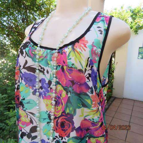 Vibrant floral sleeveless sheer polyester top with black edging and back tie - Size 36
