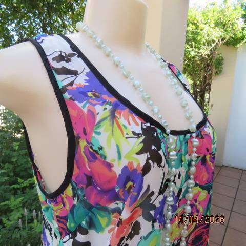 Vibrant floral sleeveless sheer polyester top with black edging and back tie - Size 36