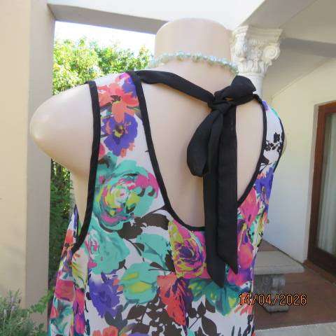 Vibrant floral sleeveless sheer polyester top with black edging and back tie - Size 36