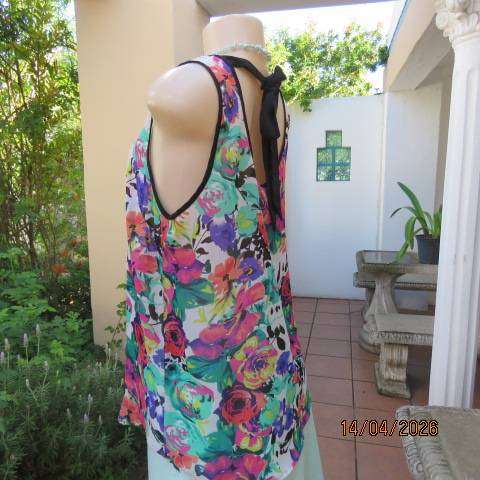 Vibrant floral sleeveless sheer polyester top with black edging and back tie - Size 36
