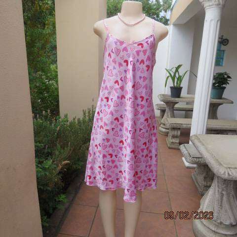 Pink silky polyester nighty with red-purple-pink heart print. With thin shoulder straps Size 42
