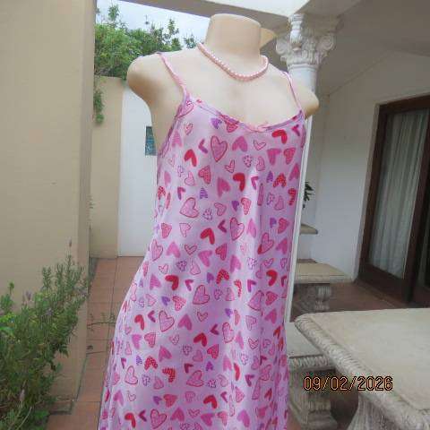 Pink silky polyester nighty with red-purple-pink heart print. With thin shoulder straps Size 42