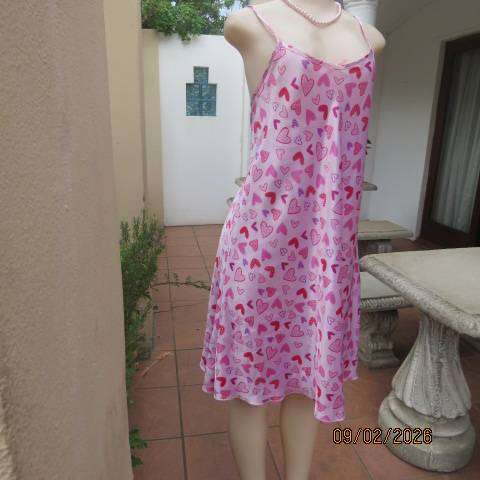 Pink silky polyester nighty with red-purple-pink heart print. With thin shoulder straps Size 42
