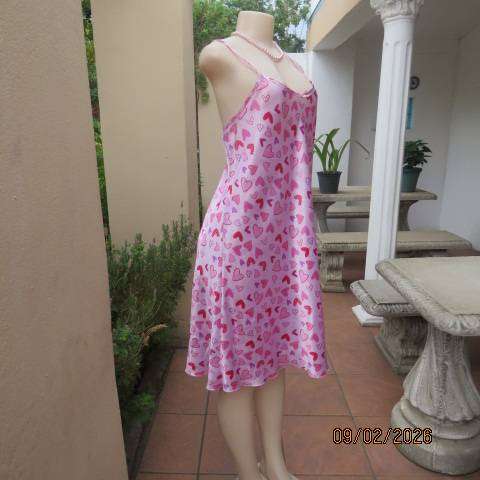 Pink silky polyester nighty with red-purple-pink heart print. With thin shoulder straps Size 42