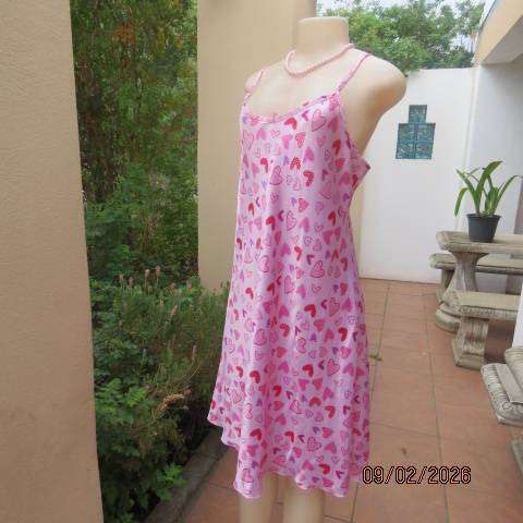 Pink silky polyester nighty with red-purple-pink heart print. With thin shoulder straps Size 42