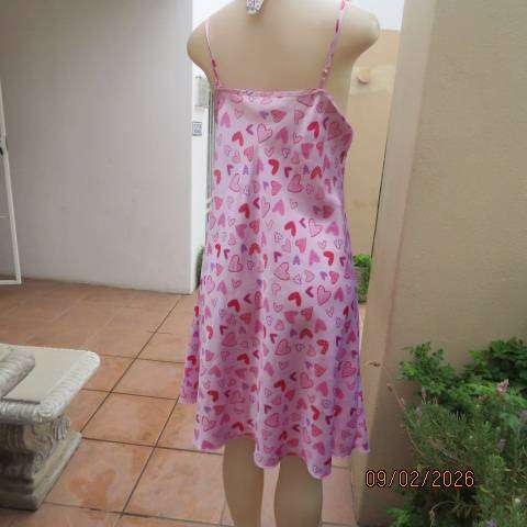 Pink silky polyester nighty with red-purple-pink heart print. With thin shoulder straps Size 42
