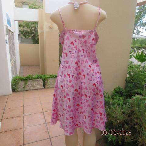 Pink silky polyester nighty with red-purple-pink heart print. With thin shoulder straps Size 42