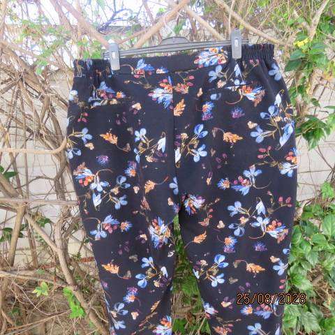 DONNA black stretch polyester skinny pants with blue and crimson floral print, size 46