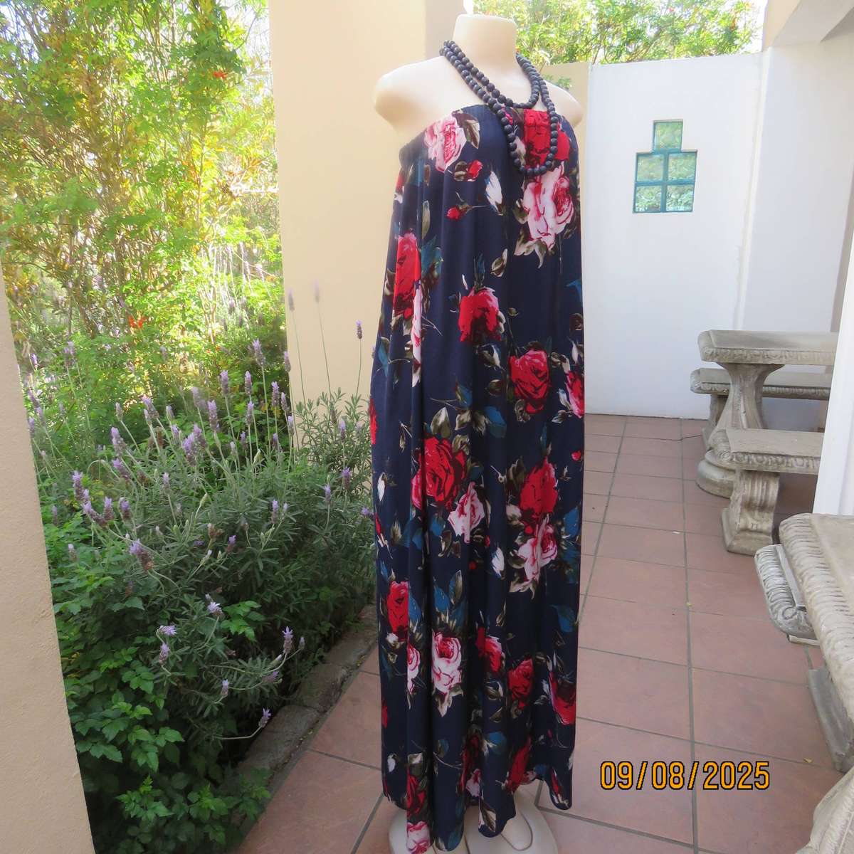 Navy maxi viscose strapless dress with bold red roses. Elasticated neckline. Size 34-38