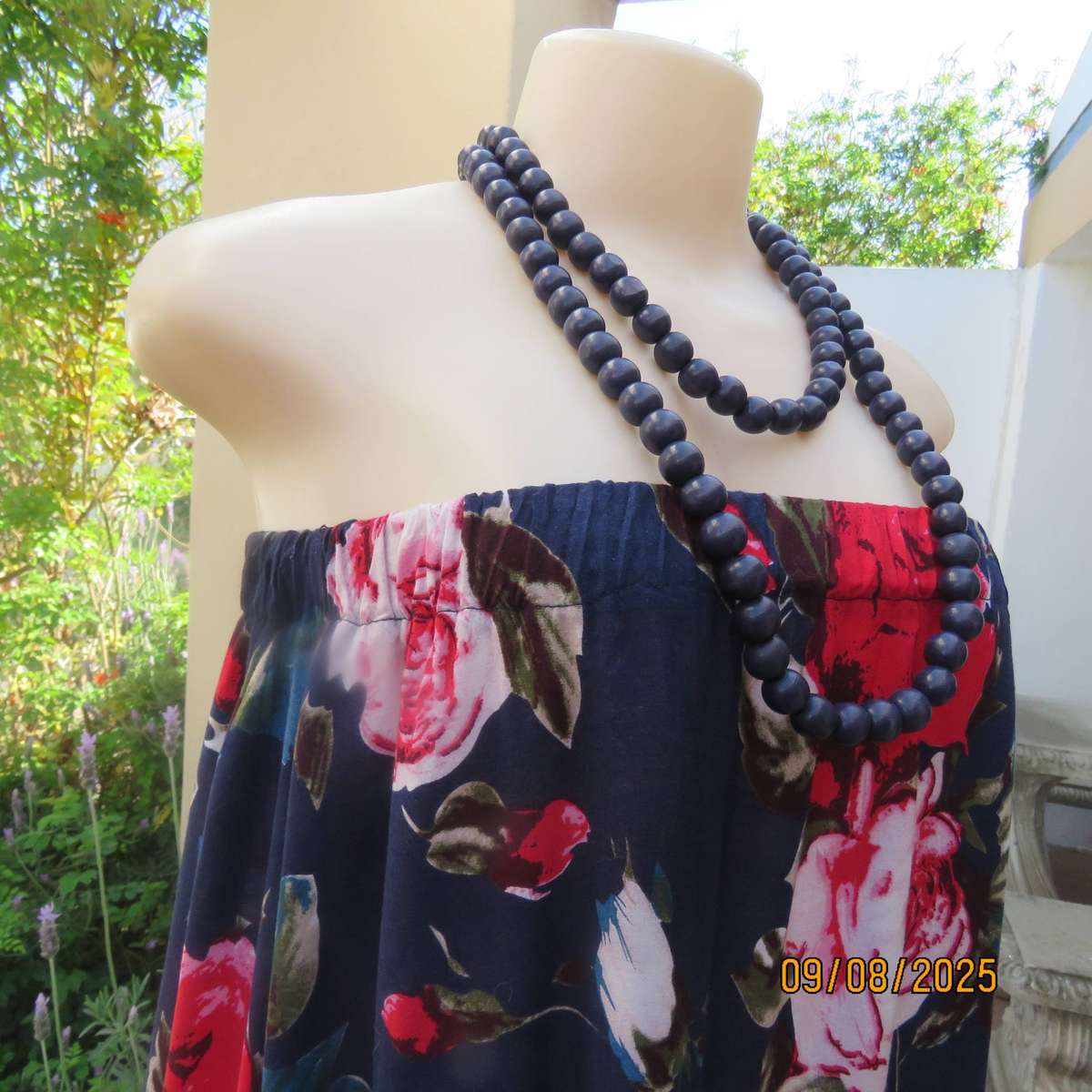 Navy maxi viscose strapless dress with bold red roses. Elasticated neckline. Size 34-38