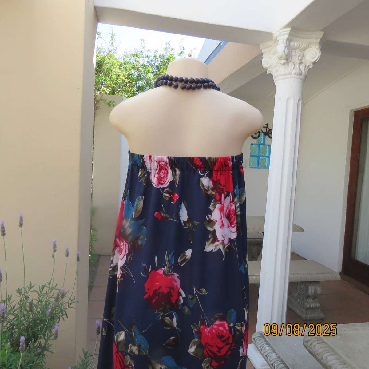 Navy maxi viscose strapless dress with bold red roses. Elasticated neckline. Size 34-38