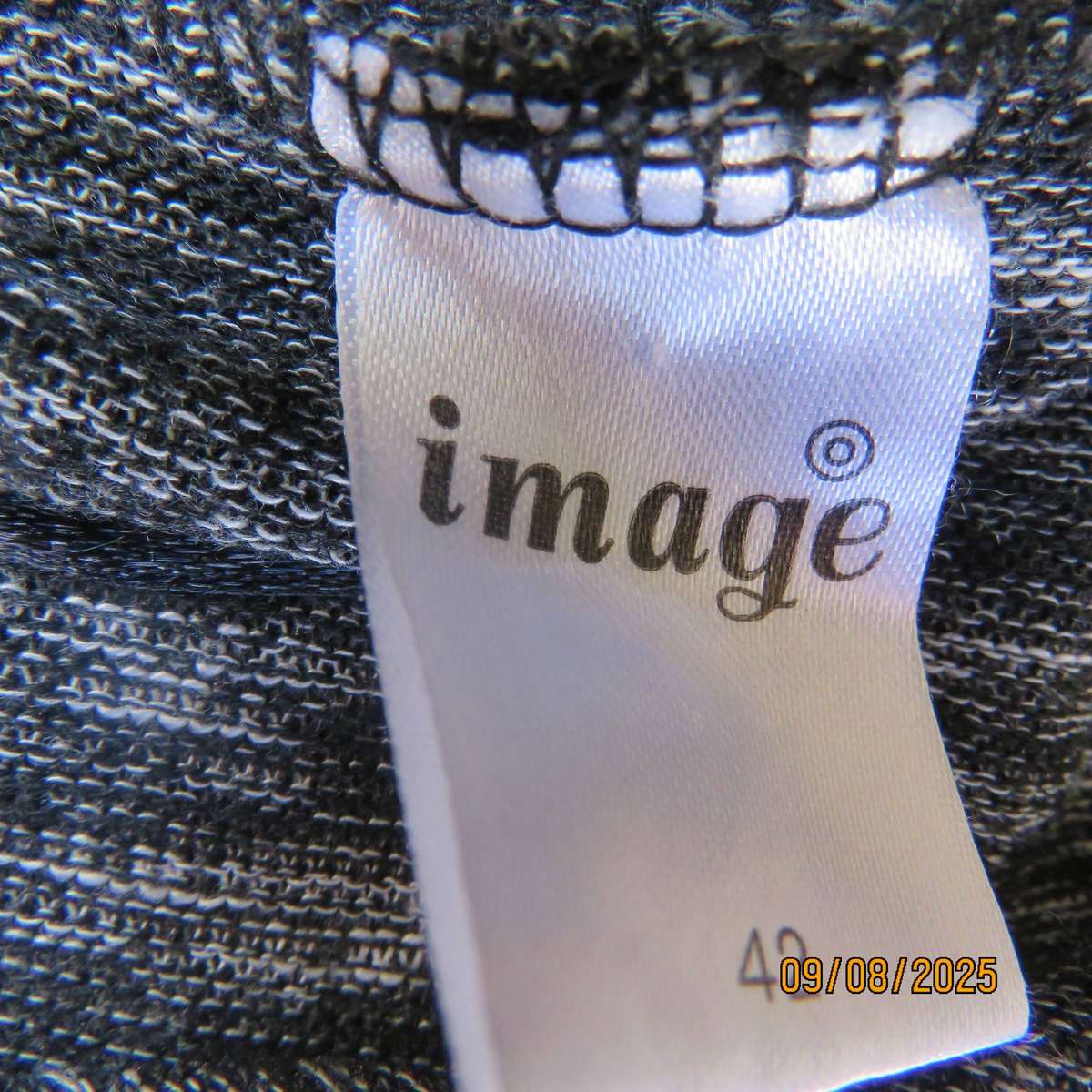 Black-white mottled light weight long sleeve open front stretch polyester cardigan . Size 42