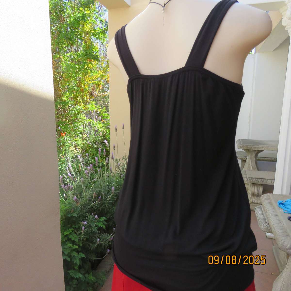 OASIS black stretch rayon slip over top front yoke richly sequined. Size 36