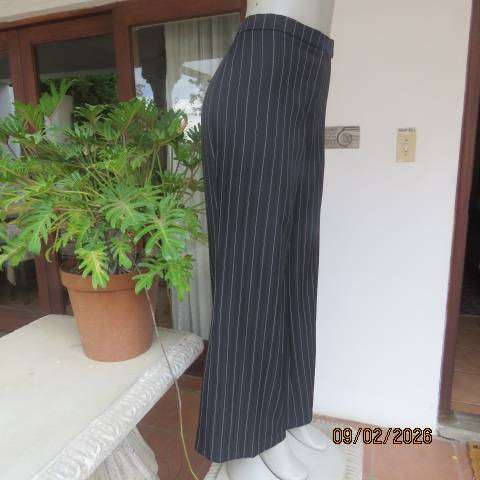 CONTEMPO black stretch polyester with white and embossed vertical stripes. Size 40