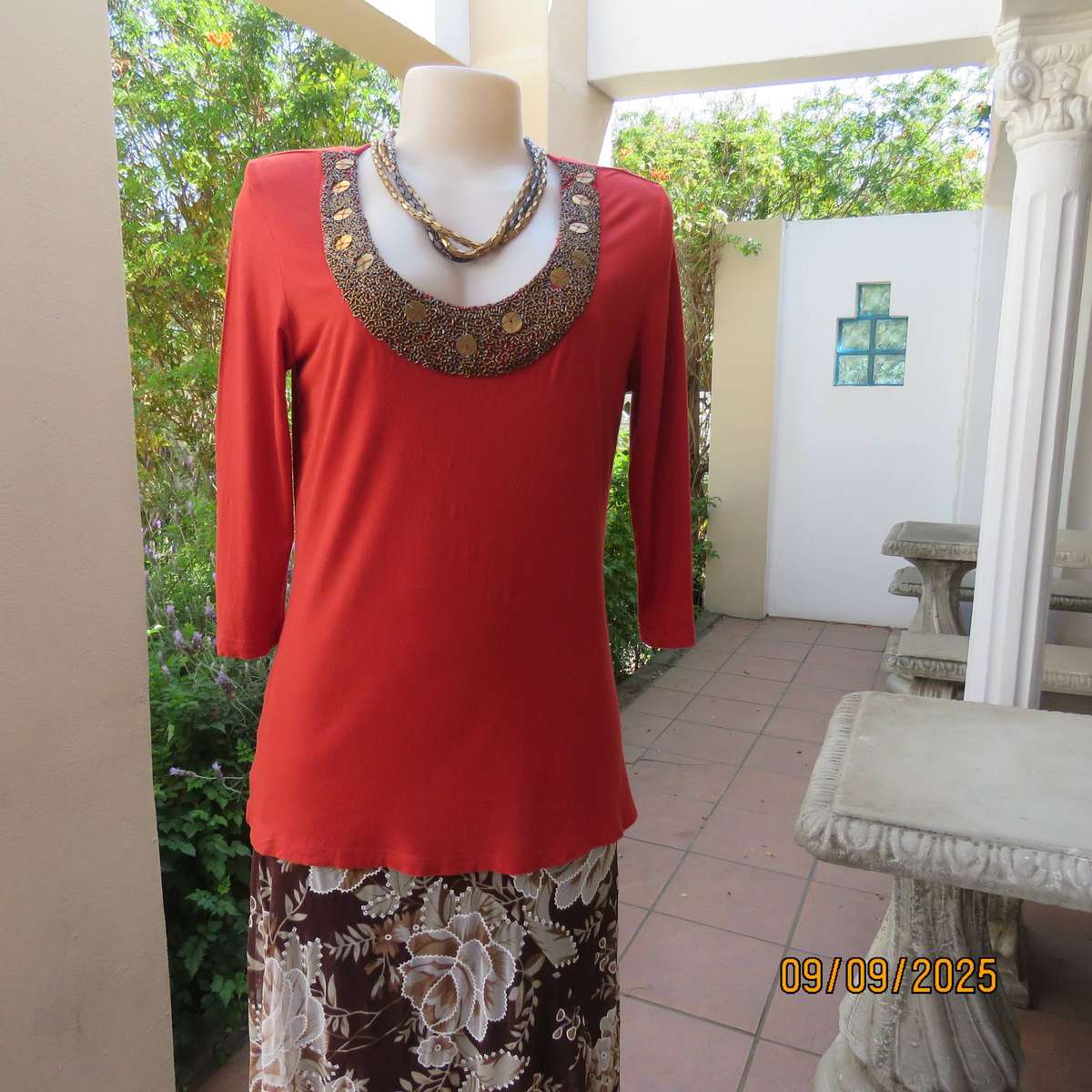 WOOLWORTHS burnt orange stretch viscose top with antique gold neckline embellishment. Size 38